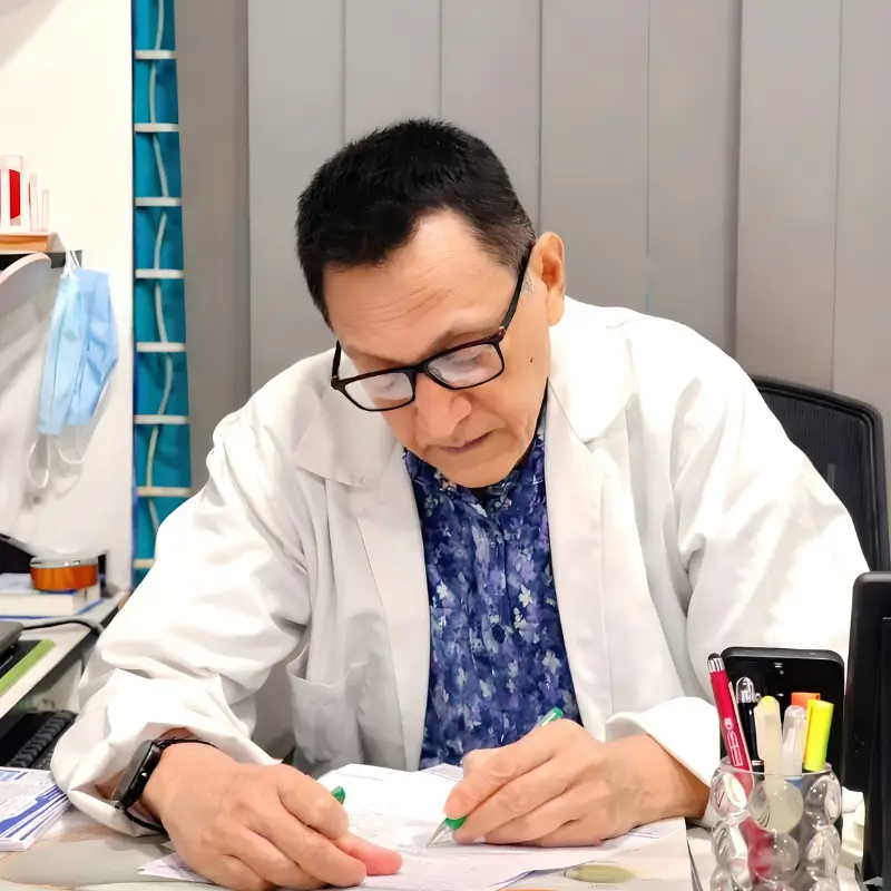 Dr. Md. Salahuddin Rahmatullah Shaheen, ophthalmologist and pediatric squint specialist, performing a clinical eye examination for a patient.